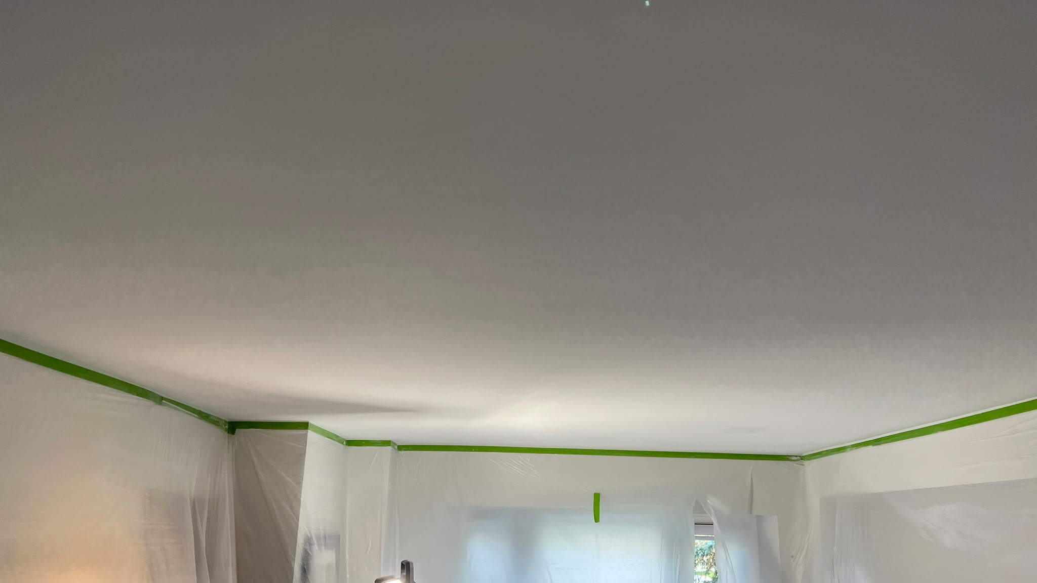 After: smooth ceiling following popcorn removal
